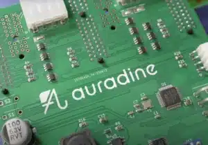 Close-up of an Auradine circuit board featuring precision components, power connectors, and the Auradine logo.