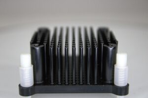Side profile of Dark Horse aluminum Bitaxe heatsink upgrade showing tall black pin fins and nylon tool-free standoffs.