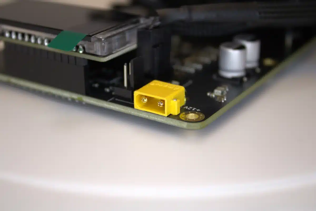 Close-up of yellow XT30 power connector and thicker copper planes on NerdQaxe++ Rev 6 PCB