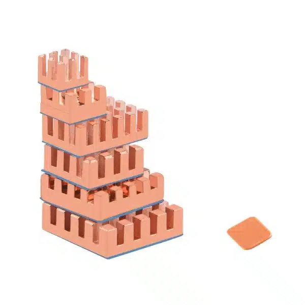 Stack of five pure-copper mini-heatsinks arranged by size with a single flat thermal pad beside them