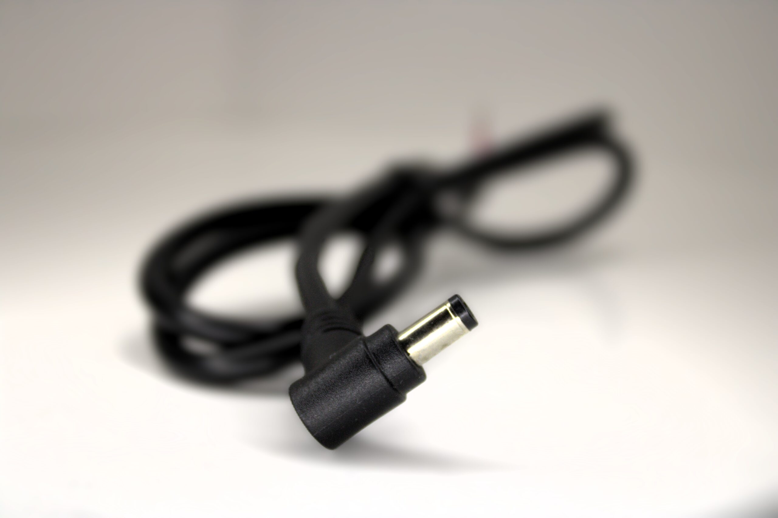 5.5 x 2.1mm right angle DC male barrel connector closeup on 1 m 18 AWG pigtail for 12V power to Bitaxe.