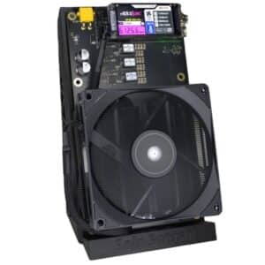 NerdQaxe++ Rev 6.1 mini bitcoin miner with quad BM1370 ASIC chips, large 120mm cooling fan, color display showing 6126.8 GH/s hashrate, and XT30 power connector on Solo Satoshi stand