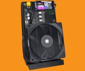 NerdQaxe++ Rev 6.1 quad-chip Bitcoin solo miner on black Solo Satoshi stand with 92mm fan, color LilyGO display showing 6,126 GH/s hashrate and 102W power draw, XT30 connector, and BM1370 ASIC label