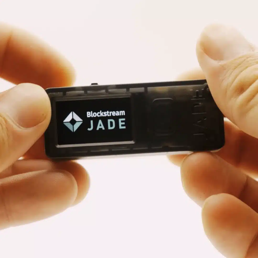 Close-up of Blockstream Jade bitcoin hardware wallet showing the Blockstream Jade logo on screen