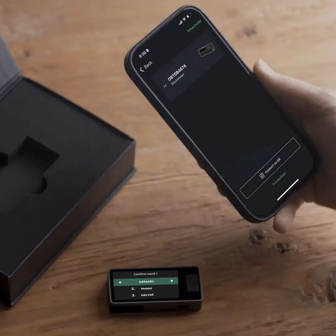 Blockstream Jade hardware wallet setup shown with smartphone app pairing and wallet confirmation screen