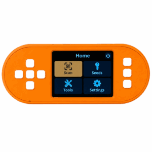 Orange SeedSigner+ powered on showing the SeedSigner OS home screen with Scan, Seeds, Tools, and Settings menu options on the 2.8 inch color display
